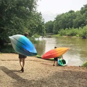 Staff Carrying Kayaks to the river