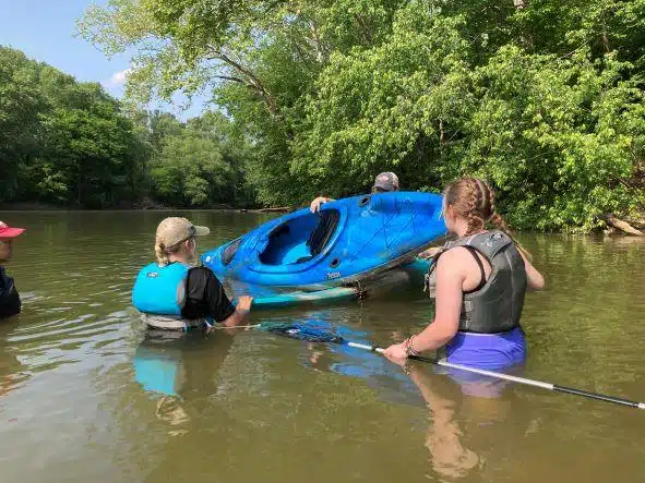 Advanced Kayaking Class learning to empty a kayak